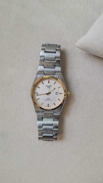 ساعت پسرانه تیسوت سیلور طلایی صفحه سفید کد 1601